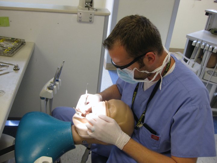 Dental Student Working on a Mannequin