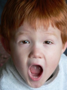 A Red Headed Boy with Baby Teeth