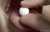Putting Aspirin on Toothache