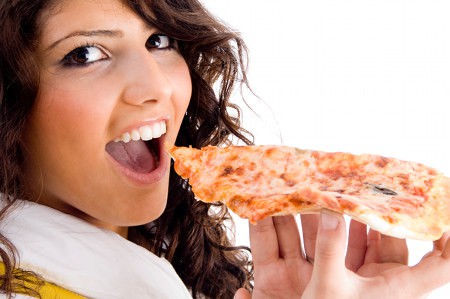 Young Woman Eating Pizza